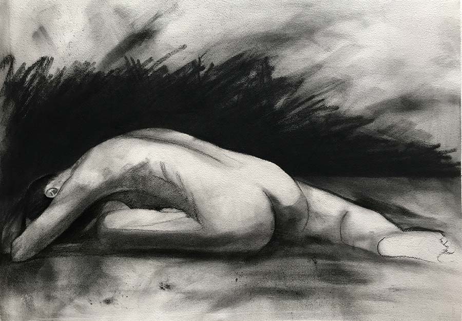 Life drawing of a woman in charcoal
