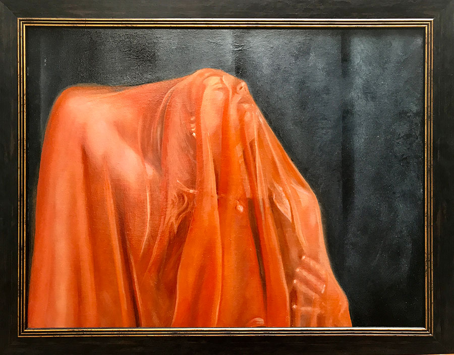 Woman under an orange veil